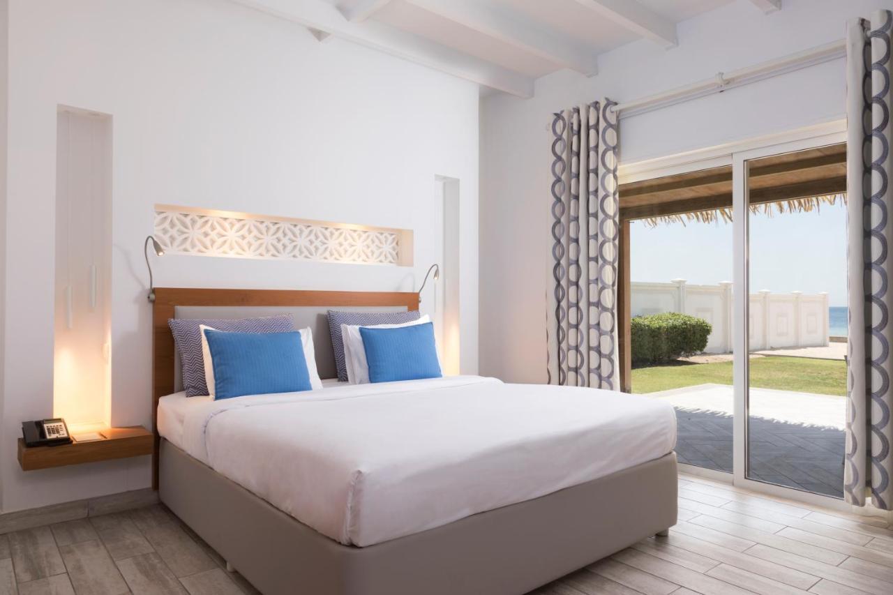 Sealine Beach, A Murwab Resort มีไซอีด ภายนอก รูปภาพ A bedroom at the resort